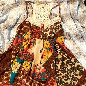 Day trip lightweight babydoll tank with lace detail.